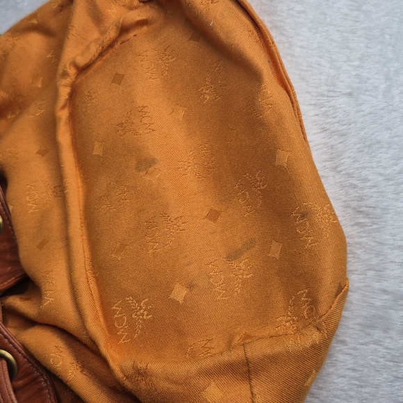 MCM Cognac Leather Drawstring Shoulder Crossbody Bucket Bag with Charm - Picture 15 of 17